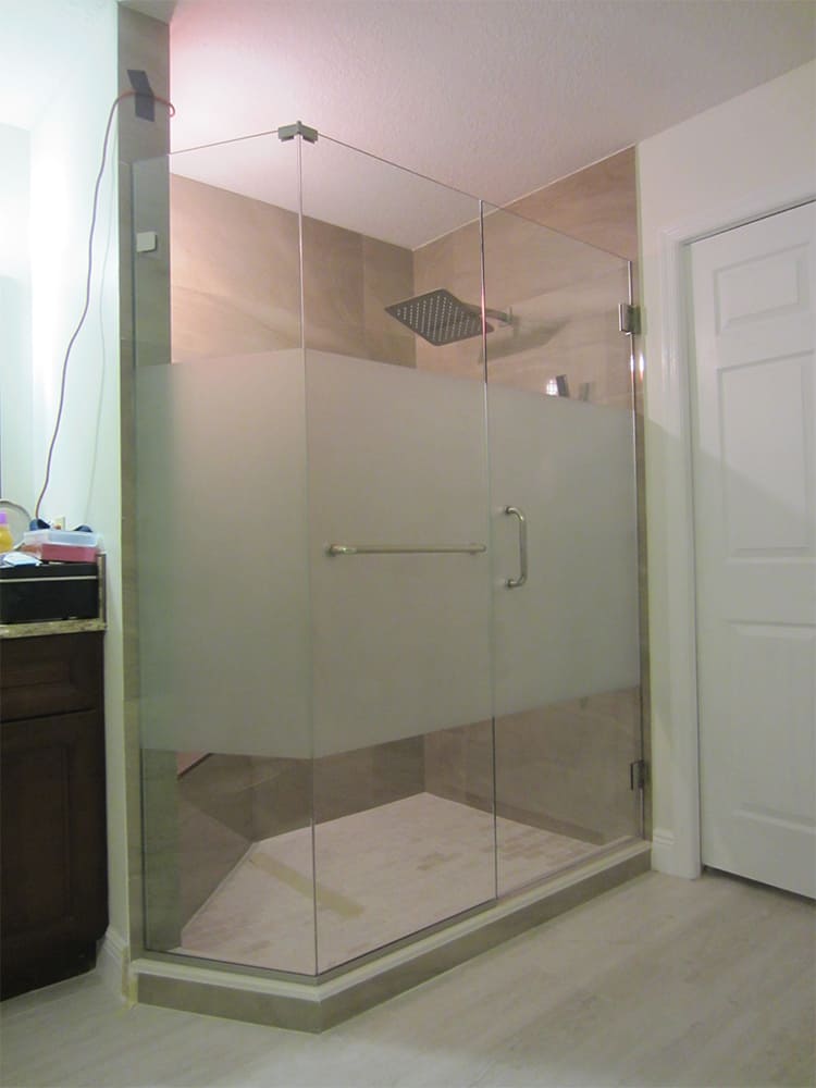 Frosted glass shower door installed in a bathroom