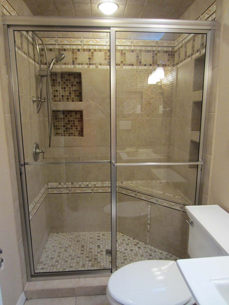 Framed bypass shower door example in bathroom