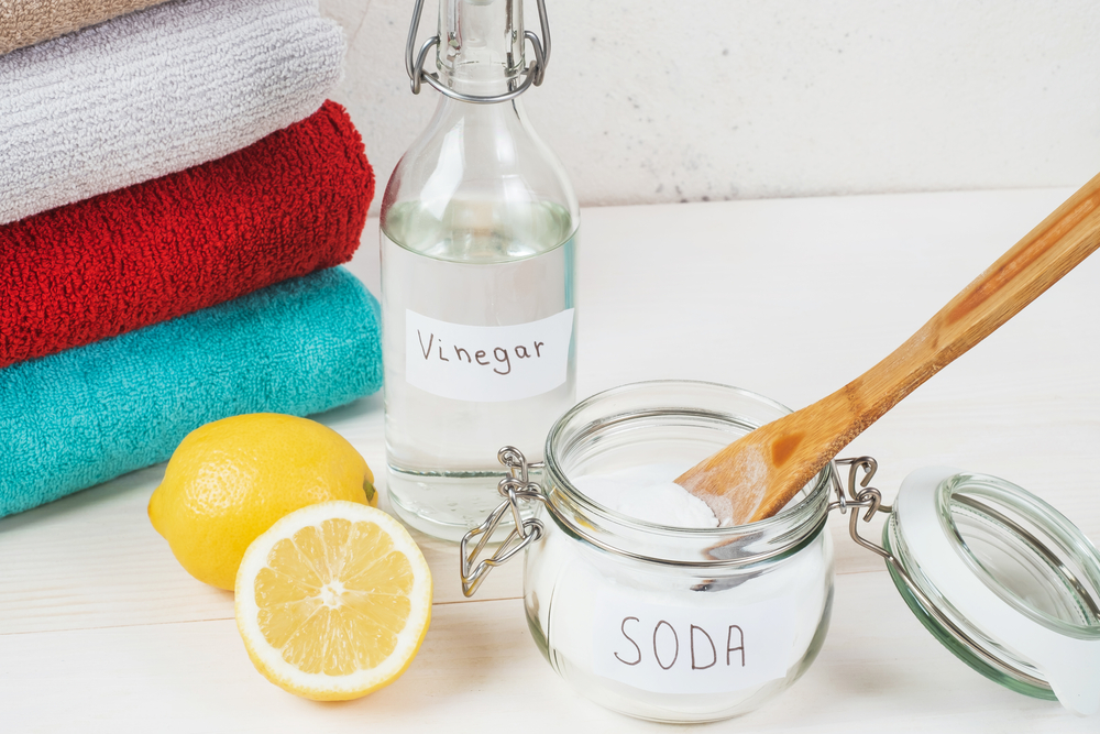 Baking soda in jar with a wooden spoon on top