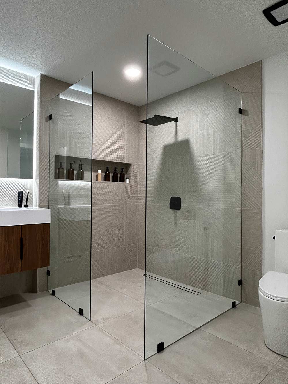 a glass shower door enclosure